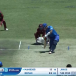 Afghanistan cricketers celebrate a wicket during the first T20 International against West Indies at Dubai International Cricket Stadium, marking their strong start to the series.