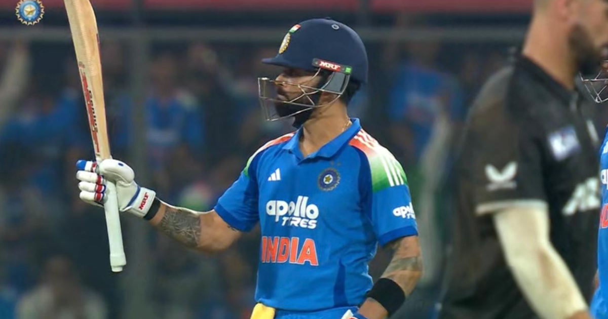 “Virat Kohli raises his bat after scoring his 54th ODI century during the third ODI against New Zealand at Holkar Stadium, Indore.”